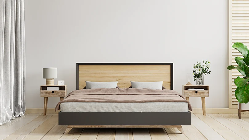 une image d'un lit avec des tables de nuit dans une chambre à coucher