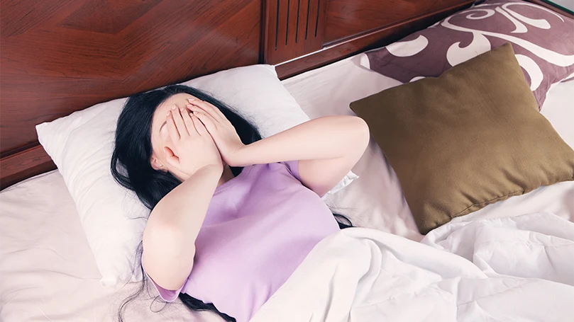Image d'une femme souffrant de troubles du sommeil.