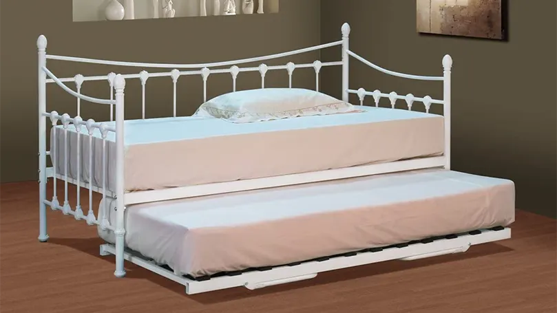 An image of A modern trundle bed with metal frame.