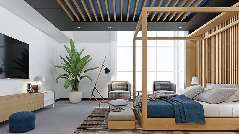 Image d'une chambre à coucher moderne avec un lit à baldaquin.
