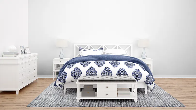 Image d'un lit avec des draps bleus.