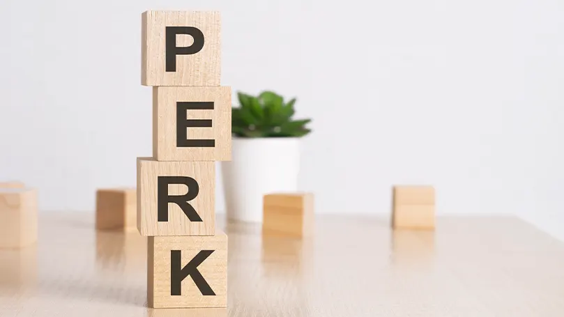 Une image de blocs de bois avec le mot "perk" en toutes lettres